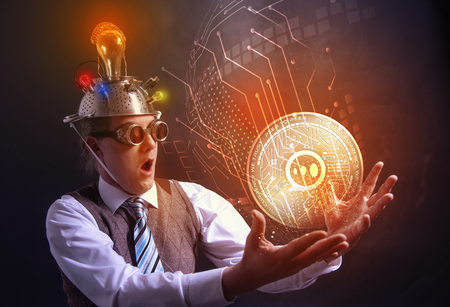 distraught looking conspiracy believer in suit with aluminum foil head with E-CHAT cryotocurrency coinの写真素材