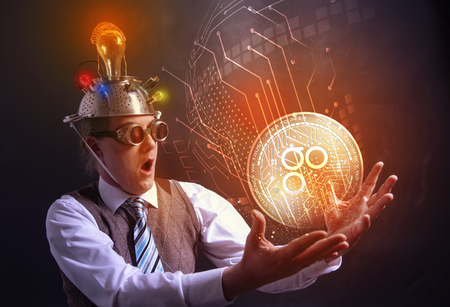 distraught looking conspiracy believer in suit with aluminum foil head with OMISEGO cryotocurrency coinの写真素材