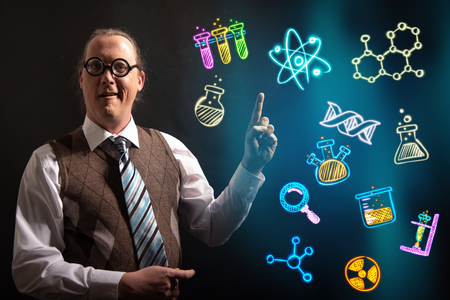 Funny scientist looking to chemistry symbols chemicalの写真素材