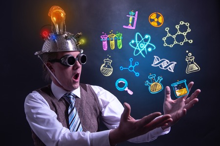 Funny scientist looking to chemistry symbols chemicalの写真素材