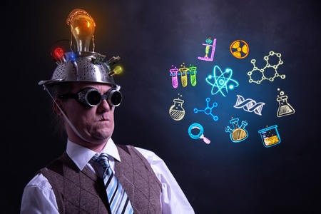 Funny scientist looking to chemistry symbols chemicalの写真素材