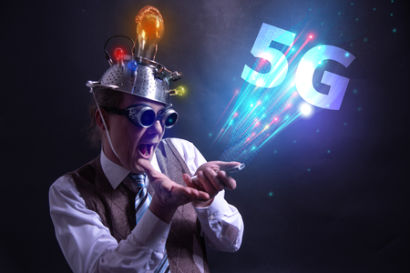 Funny nerd or geek wiith tablet and 5G symbolの写真素材