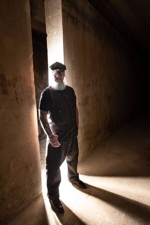 Portrait of bearded hipster with tattooe on his arms.の写真素材