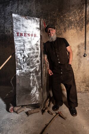 Portrait of bearded hipster with tattooe on his arms.の写真素材