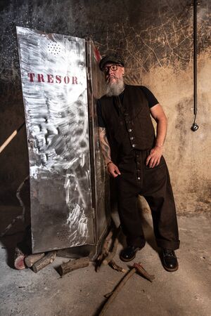 Portrait of bearded hipster with tattooe on his arms.の写真素材