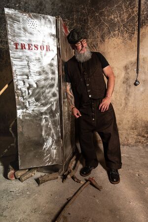 Portrait of bearded hipster with tattooe on his arms.の写真素材