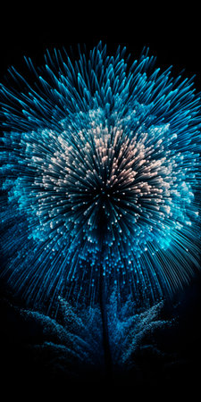 Experience the mesmerizing beauty of blue fireworks exploding in intricate detail against the dark sky.の素材