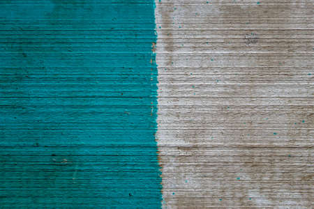 paint on a wooden board. wood texture. blue and white paintの写真素材