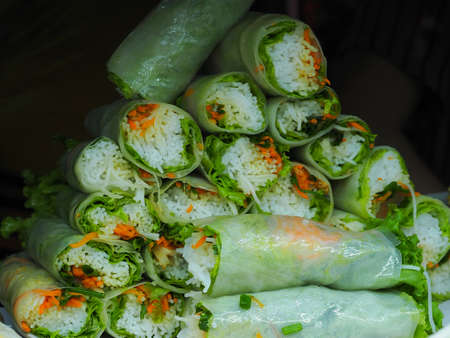 Spring rolls in night market in Hoi An. Asian street food. Vietnam, March 2017の写真素材