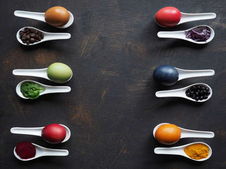Easter eggs dyeing naturally with everyday ingredients - red cabbage, coffee, turmeric, blueberries, spinach and beetroot.の写真素材