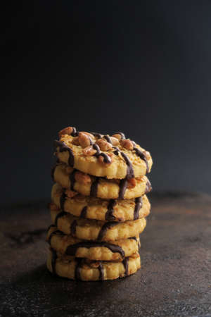 Chocolate cookies with nuts on rustic background.の写真素材