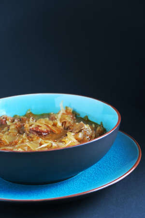 Cabbage soup on blue plate.の写真素材