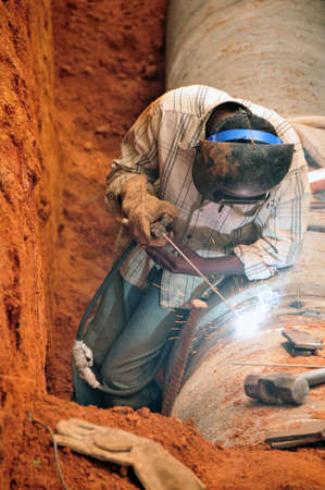 welding new water pipes in indiaの写真素材
