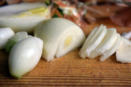 Sliced onion on a wooden board.の写真素材