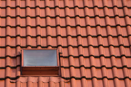 Roofing, chimney and window.の写真素材