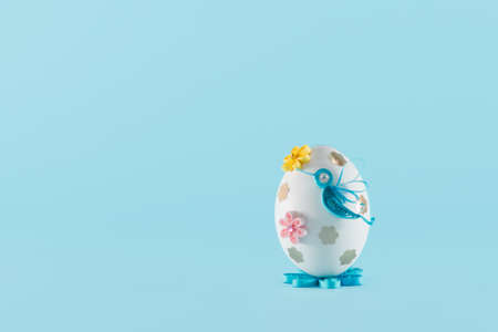 Easter egg on a blue backgroundの写真素材