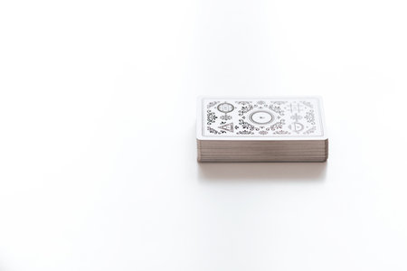 A deck of tarot cards on a white background with copy space. Tarot cards and esoteric concept. magic rituals.の写真素材