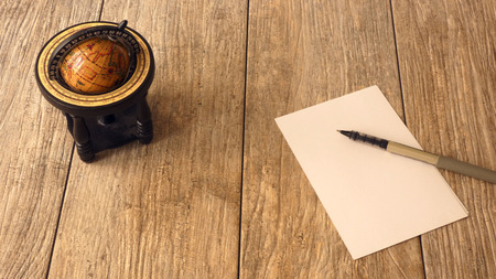 stocked a blank sheet of paper. A blank sketchbook or an album for painting on a wooden background....
