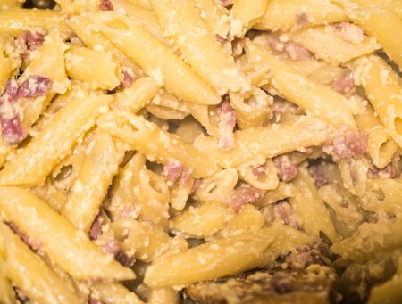 Plate with traditional Italian pasta Carbonara with grated parmesan and basil.の写真素材