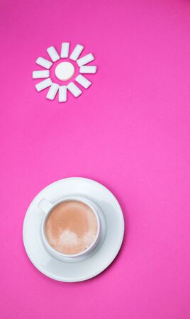 chewing gum on a light pink background. set out in the form of the sun. Bottom of coffee mug.の写真素材