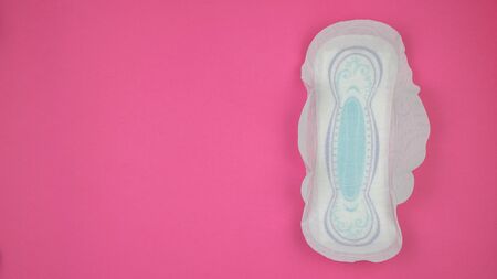 menstrual sanitary pads on red background. Critical days of women, menstrual cycle gynecological. Menstruation is a woman's sanitary hygiene for the blood period. Women's hygiene.の写真素材