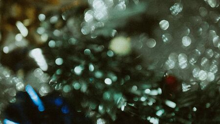 Grey Lights Festive background. Abstract Christmas twinkled bright background with bokeh defocused...