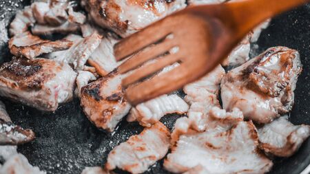 Roasted pork ribs in frying pan, top view.の写真素材