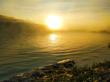 Impressive golden sunrise over the pool, beach in the foreground. Conceptual designの写真素材