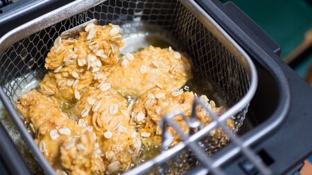sharp chicken wings in the fryer. top viewの写真素材