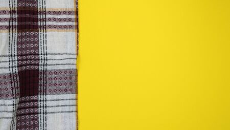 Kitchen table with tablecloth and space for your recipe or menu. Top view flat lay.