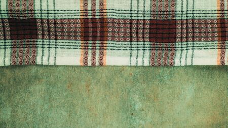 Kitchen table with tablecloth and space for your recipe or menu. Top view flat lay.