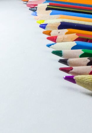 Art and drawing creative concepts of colorful crayon pencils with triangle shape on white background with copy space. Top view, Close-up, For banner design.の写真素材