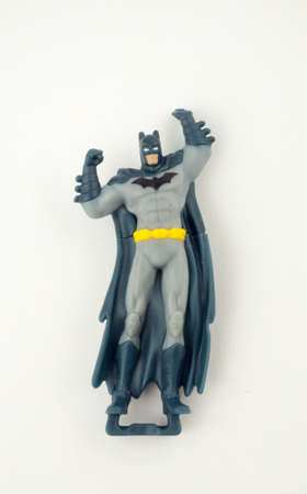 Rome Italy. March 30. 2020. Comic Batman toy figure isolated on white background. There are plastic toys that are sold as part of McDonalds Hapis food. Kinderのeditorial素材