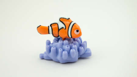 Rome Italy. March 30. 2020. nemo fish on corals isolated on white background. There are plastic toys sold as part of the McDonalds Happy meals. Kinder.のeditorial素材