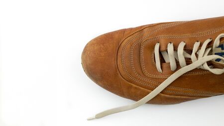 mens leather shoes with white laces placed on a white background.