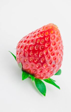 Red berry, one strawberry on white background.の写真素材