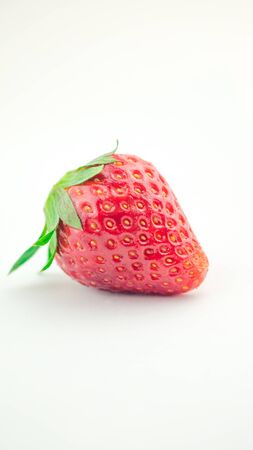 Red berry, one strawberry on white background.の写真素材