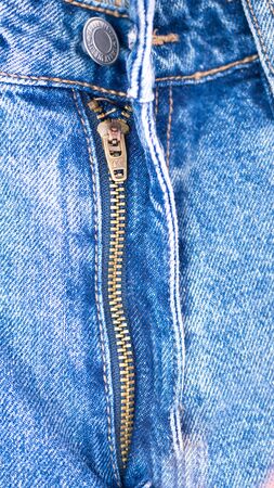 Textile - Fabric Series. Jeans Zipper Close-ups of details of a pair of Blue Jeans with zippe