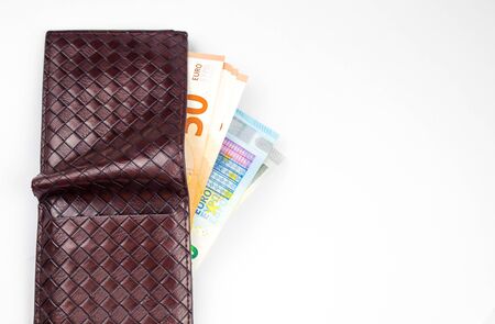 euros in purse. Isolated on a white background.の写真素材