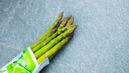 Asparagus. Fresh green asparagus on a gray slate background, Copy space top viewの写真素材