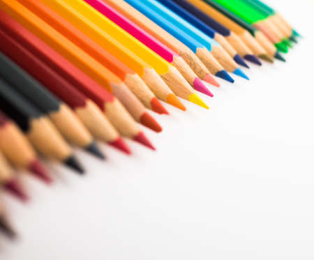 A close-up of colorful crayons isolated on a white background.の写真素材