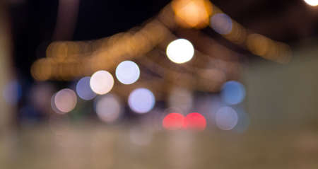 Christmas golden background. Golden holiday glowing background. Defocused background with a twinkling star, Blurred bokeh curtainの写真素材