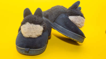 soft slippers with bunnies on a yellow background.