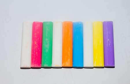colored chalk. square colorful pastel chalks tops closeup, on white background.の写真素材