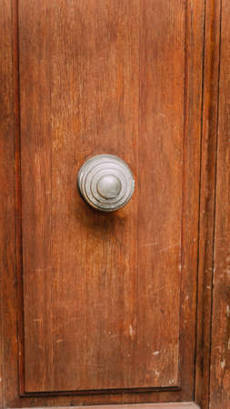 variety of knockers and handles on ancient doors in Italy. Old metal door handle on a wooden door. Art workの写真素材