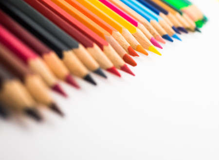 A close-up of colorful crayons isolated on a white backgroundの写真素材