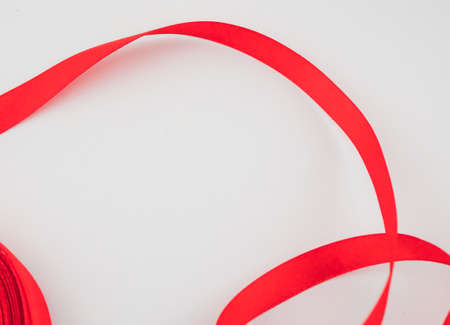 close up of a red ribbon on white backgroundの写真素材