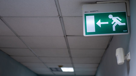 Fire exit sign in the corridor of the building