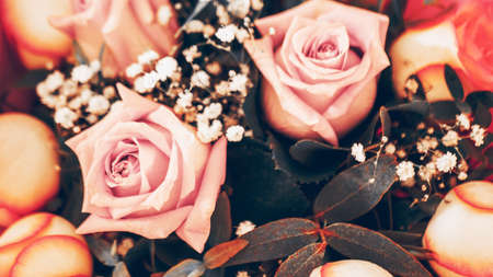 beautiful bouquet of fresh roses, carnations, eucalyptus flowers in pastel pink tones, cropped...