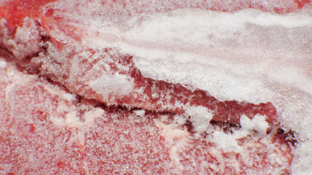 Texture of frozen fresh raw meat, close up, macro